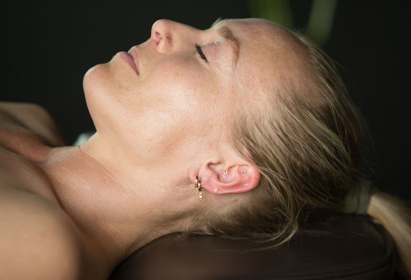 A patient resting during a facial treatment at MO+ Wellness Centre